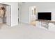 Spacious bedroom with TV, built-in closet, and access to bathroom at 180 Cherry Grove Dr, Summerville, SC 29483