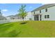 Large backyard with green lawn and view of house at 180 Cherry Grove Dr, Summerville, SC 29483