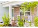 Front porch with brick columns and rocking chairs at 180 Cherry Grove Dr, Summerville, SC 29483