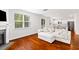 Living room with hardwood floors, fireplace, sectional sofa, and kitchen bar at 180 Cherry Grove Dr, Summerville, SC 29483
