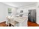 Modern kitchen with white cabinets, granite countertops, and stainless steel appliances at 180 Cherry Grove Dr, Summerville, SC 29483
