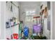 Small storage room with shelves and gardening tools at 702 Minus St, Saint George, SC 29477