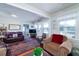 Spacious living room with comfortable seating and a view into another room at 2302 Palmetto Blvd, Edisto Beach, SC 29438