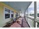 Spacious screened porch with wooden floors and comfortable seating at 2302 Palmetto Blvd, Edisto Beach, SC 29438