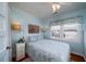 Bedroom with a queen-size bed and seashell bedding, offering a calming coastal atmosphere at 2302 Palmetto Blvd, Edisto Beach, SC 29438