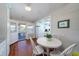 Cozy dining area with white table and chairs, near the kitchen at 2302 Palmetto Blvd, Edisto Beach, SC 29438