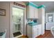 Small half bathroom with pedestal sink and tiled floor at 2302 Palmetto Blvd, Edisto Beach, SC 29438