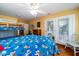 Bedroom with bunk beds, full-size bed, and access to a patio at 2302 Palmetto Blvd, Edisto Beach, SC 29438