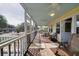 Screened porch with ceiling fan, wooden furniture, and a view of the neighborhood at 2302 Palmetto Blvd, Edisto Beach, SC 29438