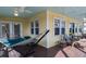 Relaxing screened porch with hammock and seating, perfect for enjoying the outdoors at 2302 Palmetto Blvd, Edisto Beach, SC 29438