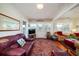 Cozy living room featuring two sofas, a TV, and an oriental rug at 2302 Palmetto Blvd, Edisto Beach, SC 29438