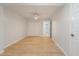 Well-lit bedroom featuring light wood flooring and ceiling fan at 7049 Kenneth Dr, North Charleston, SC 29406