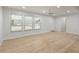 Spacious living room with large windows and hardwood floors at 7049 Kenneth Dr, North Charleston, SC 29406