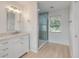 Modern bathroom with white vanity, marble countertop, and a walk-in shower at 7049 Kenneth Dr, North Charleston, SC 29406