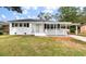 One-story house with carport and white picket fence at 7049 Kenneth Dr, North Charleston, SC 29406