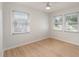 Bright bedroom featuring light walls, wood flooring, and ample natural light at 7049 Kenneth Dr, North Charleston, SC 29406