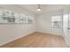 Spacious bedroom with light walls, wood flooring, and multiple windows at 7049 Kenneth Dr, North Charleston, SC 29406