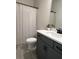 Bathroom with gray vanity, white countertop, and shower at 145 Winding Grove Ln, Moncks Corner, SC 29461