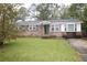 Brick ranch home with a well-maintained lawn at 501 Hansford Dr, Goose Creek, SC 29445