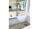 Modern white kitchen sink with gold faucet and stainless steel drainer at 3881 Summerton St, Mount Pleasant, SC 29466