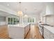 Open concept kitchen with white cabinets, marble countertops, and hardwood floors at 3881 Summerton St, Mount Pleasant, SC 29466