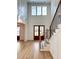 Bright entryway with hardwood floors, double doors, and a grand staircase at 3881 Summerton St, Mount Pleasant, SC 29466