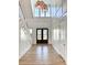 Bright two-story foyer with hardwood floors, staircase, and high ceilings at 3881 Summerton St, Mount Pleasant, SC 29466