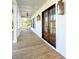 Inviting front porch with wooden flooring and double front doors at 3881 Summerton St, Mount Pleasant, SC 29466