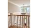 Elegant staircase with chandelier and wood railing at 3881 Summerton St, Mount Pleasant, SC 29466