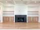 Living room featuring a fireplace, built-in shelving, and hardwood floors at 3881 Summerton St, Mount Pleasant, SC 29466