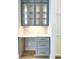 Gray built-in desk with glass-front cabinets and quartz countertop at 3881 Summerton St, Mount Pleasant, SC 29466