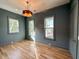 Bright bedroom with light walls, hardwood floors, and multiple windows at 3881 Summerton St, Mount Pleasant, SC 29466