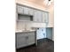 Laundry room with light grey cabinets and dark floor tile at 3881 Summerton St, Mount Pleasant, SC 29466
