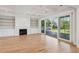 Living room with hardwood floors, fireplace, and access to deck at 3881 Summerton St, Mount Pleasant, SC 29466