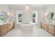 Elegant bathroom with double vanities, free-standing tub, and marble floors at 3881 Summerton St, Mount Pleasant, SC 29466