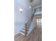 Elegant staircase with wooden banister and black metal railing at 3881 Summerton St, Mount Pleasant, SC 29466