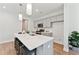 Modern kitchen island with quartz countertops and seating for three at 426 Queenview Ln, Charleston, SC 29414