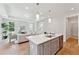 Modern kitchen with island, stainless steel appliances, and light gray cabinets at 426 Queenview Ln, Charleston, SC 29414