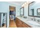 Double vanity bathroom with granite countertop and walk-in closet at 101 Westmoreland St, Summerville, SC 29483