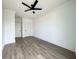 Spacious bedroom with hardwood floors and ceiling fan at 2216 Clinton St, North Charleston, SC 29405