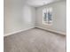 Well-lit bedroom with window and wall-to-wall carpet at 209 Turner Greens Ct, Goose Creek, SC 29445