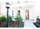Inviting front porch with white columns and landscaping at 123 Cantona Dr, Summerville, SC 29483