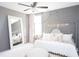 Bright bedroom with a large bed, plush bedding and a full-length mirror at 123 Cantona Dr, Summerville, SC 29483