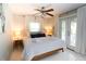 Bedroom with a queen bed, light and airy with access to a balcony at 1225 Tabby Dr, Folly Beach, SC 29439