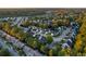 Aerial view of a residential neighborhood with houses and trees at sunset at 3199 Sonja Way, Mount Pleasant, SC 29466