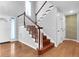 Elegant wooden staircase with white spindles at 231 Archibald Dr, Goose Creek, SC 29445