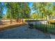 Large backyard with wooden fence, gravel area, and above ground pool at 154 Pecan Dr, Summerville, SC 29483