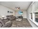 Relaxing living room with hardwood floors, comfortable seating, and large TV at 154 Pecan Dr, Summerville, SC 29483
