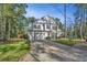 Two-story home with white siding, a gray door, and a two-car garage at 154 Pecan Dr, Summerville, SC 29483