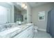 Bathroom with double vanity, granite countertop, and a large mirror at 154 Pecan Dr, Summerville, SC 29483